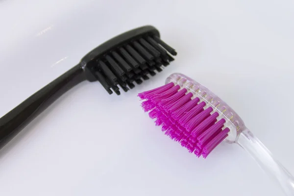 Two Toothbrushes Pink Black Color White Washbowl Bathroom — Stock Photo, Image