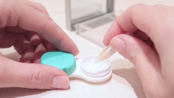 Cropped Female Hands Taking Contact Lenses Out Container — Stock Video