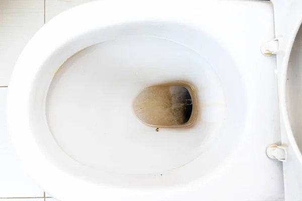 Dirty unhygienic toilet bowl with limescale stain at public restroom close up — Stock Photo, Image