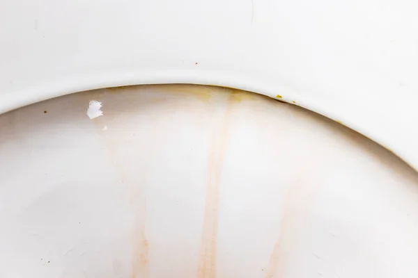Dirty unhygienic toilet rim with limescale and rust stain at public restroom close up — Stock Photo, Image