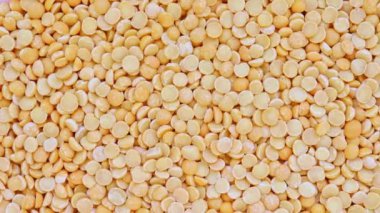 Kuru sarı bölünmüş bezelye rotasyon arka plan doku, bitkisel protein kaynağı fo vejetaryenler ve veganlar