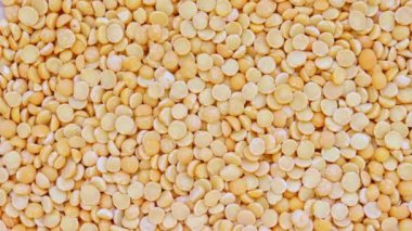 Kuru sarı bölünmüş bezelye rotasyon arka plan doku, bitkisel protein kaynağı fo vejetaryenler ve veganlar
