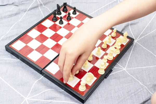 Hand of a child playing chess close up, board games and entertainment concept — Stock Photo, Image