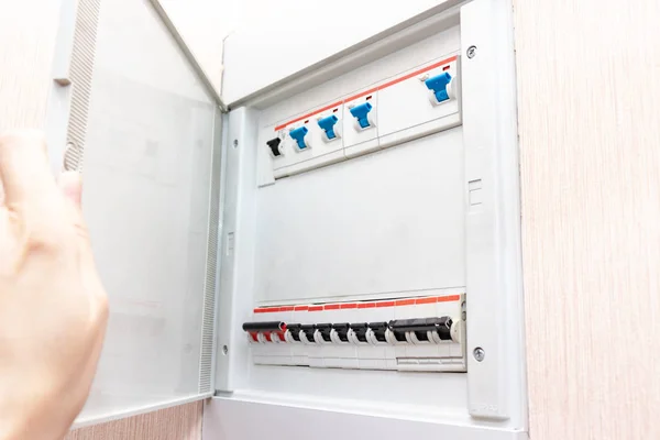 Hand opening electrical shield with automatic switches of electricity in the house - electricity control panel with circuit breakers