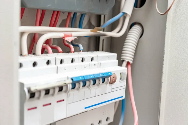 Automatic switches and wires in electrical shield close up — Stock Photo, Image