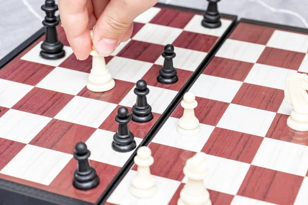 Hand of a child playing chess close up, board games and entertainment concept — Stock Photo, Image