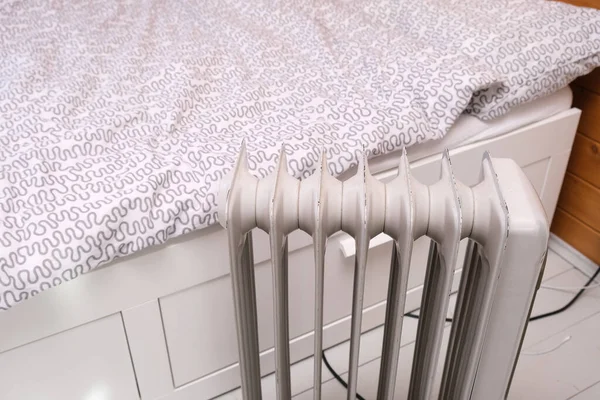 Oil-filled electrical mobile radiator heater for home heating and comfort control in the room.