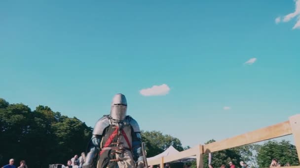 Ukraine, Kiev, June 9, 2018. Knight Tournament. Warrior in iron armor go to the stadium — Stock Video