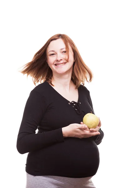 Piękna kobieta w ciąży szczęśliwy trzyma jabłko w jej ręce — Zdjęcie stockowe