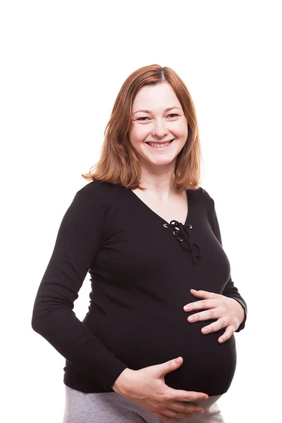 Χαμογελώντας έγκυος γυναίκα απομονωθεί σε λευκό φόντο — Φωτογραφία Αρχείου