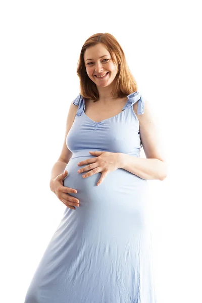 Mulher grávida vestindo um longo vestido azul — Fotografia de Stock