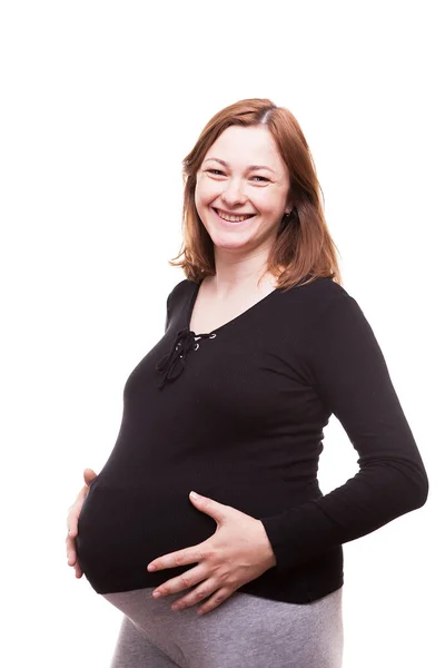Mujer rubia embarazada sosteniendo su vientre —  Fotos de Stock