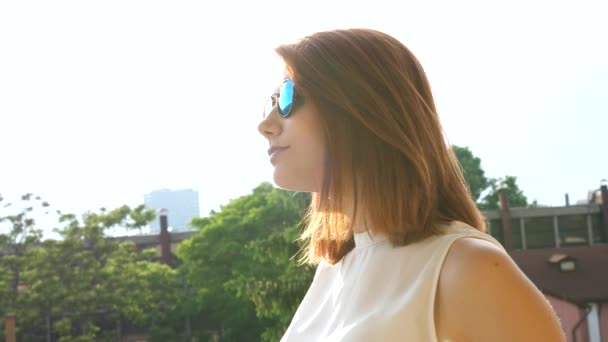 Portrait of cool redhead woman in hipster glasses — Stock Video