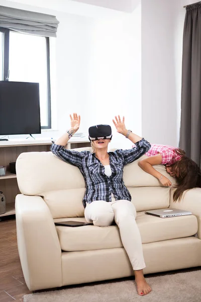 Woman wearing a virtual reality VR headset on her head