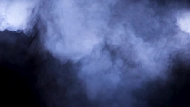 Thick smoke over a black background — Stock Video