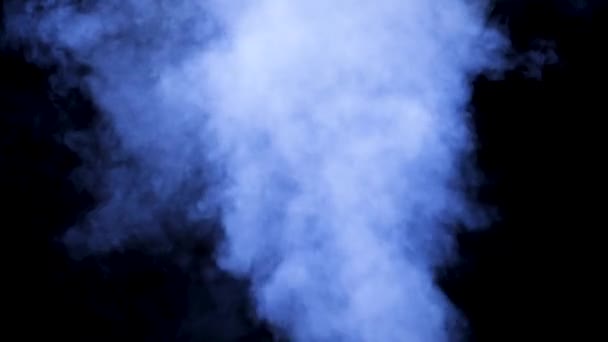 Smoke rises from above over a black background — Stock Video