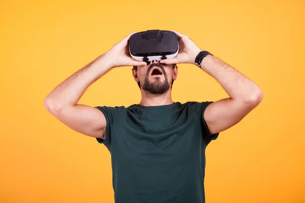 VR virtual reality headset on amazed man head