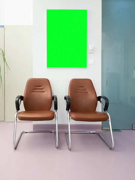 Waiting room in hsopital hall with a green screen board — Stock Photo, Image