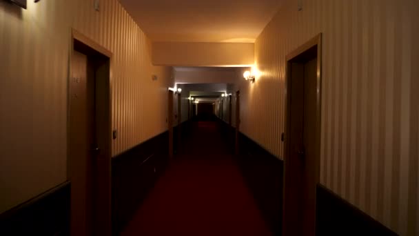 POV footage walking in poorly lit hotel hall — Stock Video