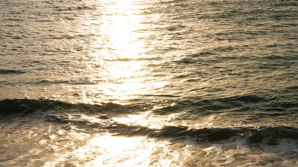 Seascape. Sun in the clouds at sunset over the sea — Stock Photo, Image