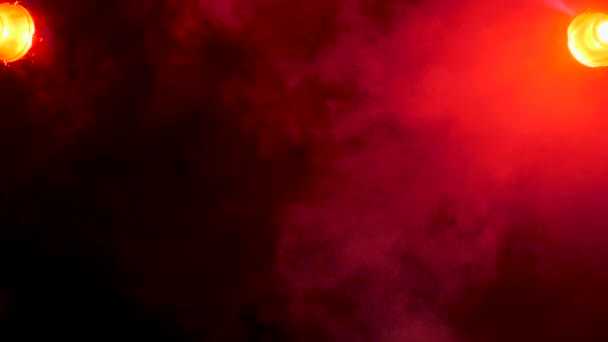 Dispersing red fumes over a black background — Stock Video