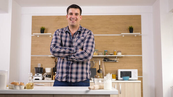 Potrait of young man in his kitchen