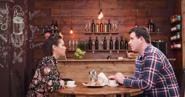 Zoom in shot of bearded waiter checking on his clients — Stock Video