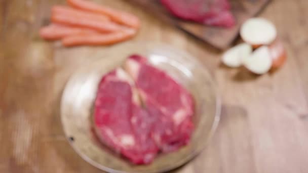 Sliding towards a raw chunk of beef meat — Stock Video