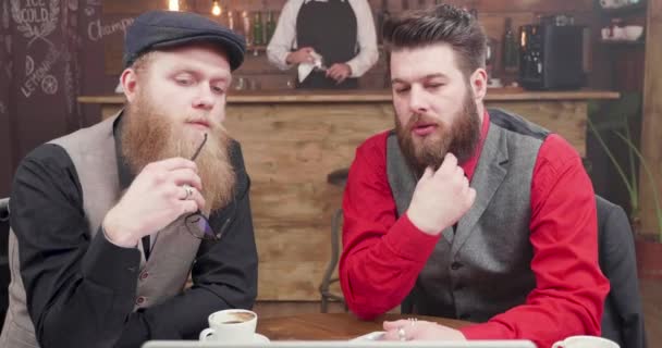 Informal business video conference with two bearded guys in a vintage pub — Stock Video