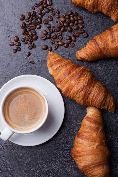 Top view of coffee and croissant with coffee beans — Stock Photo, Image