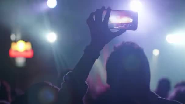 Filming on smartphone a very dynamic and bright concert performance — Stock Video