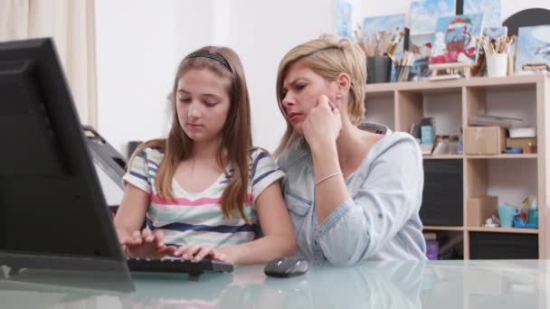 Young girl is confused with her homework and her parent tries to help — 비디오