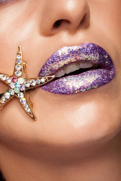 Close up of creative purple lipstick with glitter and diamond star — Stock Photo, Image
