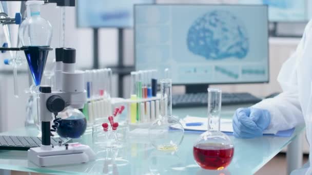 Close up of scientist taking samples from various liquids — Stock Video