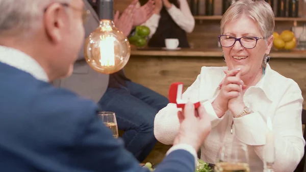 Cute old lady full of emotions when her husband is giving her a ring — Stock Photo, Image