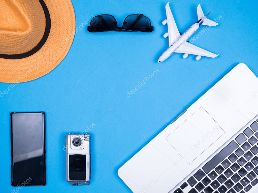 Flat lay bussines man accessories for vacation over blue background