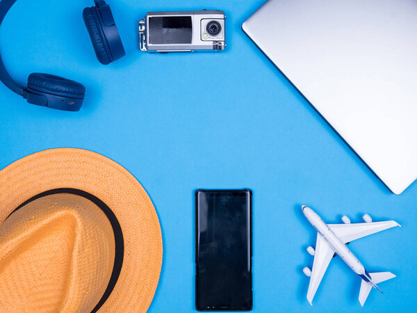Flat lay top view of traveler bussinesman acccesories over blue background
