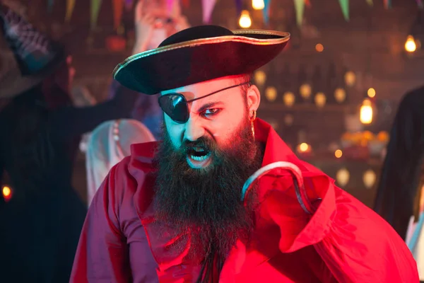 Portrait of handsome bearded man screaming and dressed up like a pirate at halloween celebration — Stock Photo, Image