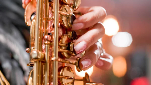 Close up hands of woman singer on a jazz concert