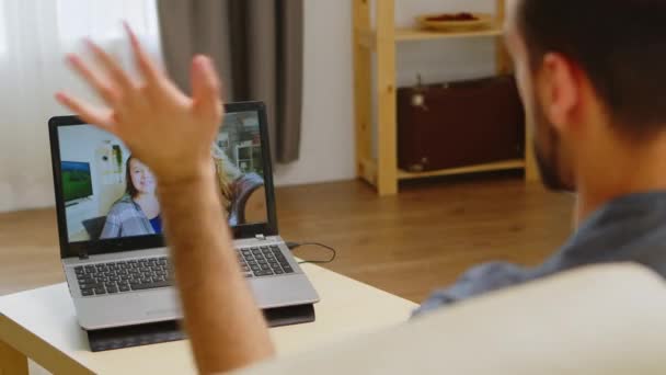 Back view of excited man on a video call — Stock Video