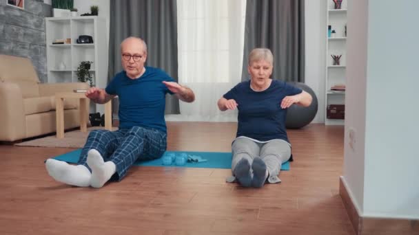 Cheerful senior couple exercising — Stock Video