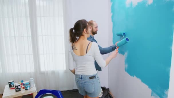 Painting wall with roller brush — Stock Video