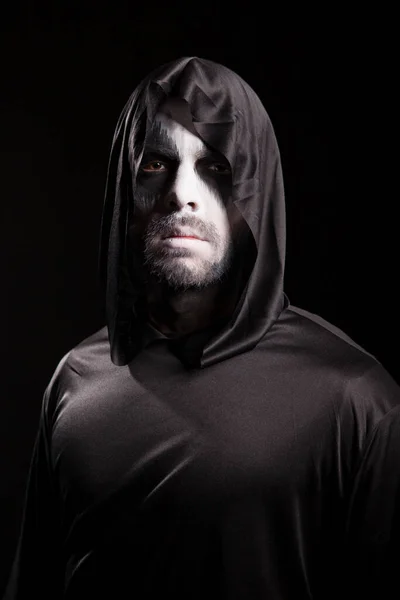 Creepy man dressed up like grim reaper
