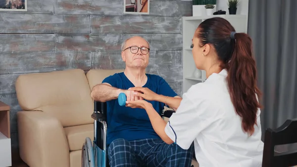 Caregiver helping senior man