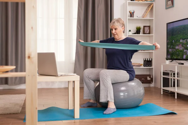 60 years old woman exercising — Stock Photo, Image