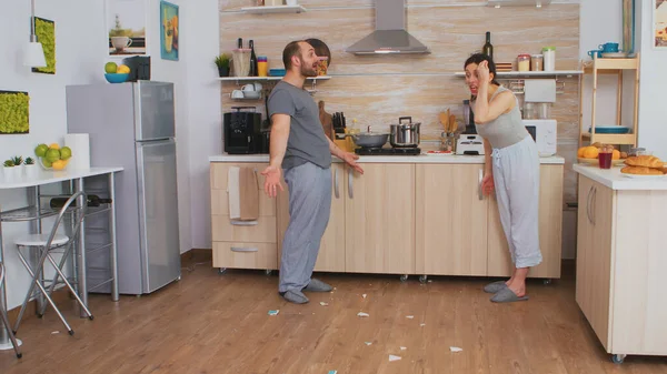 Angry wife smashing dish — Stock Photo, Image