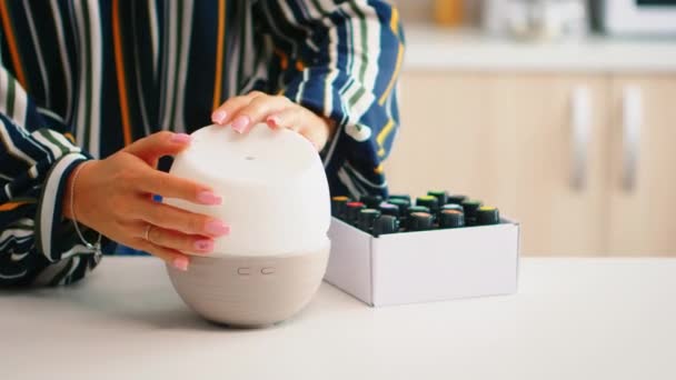 Closing lead on essential oils diffuser — Stock Video