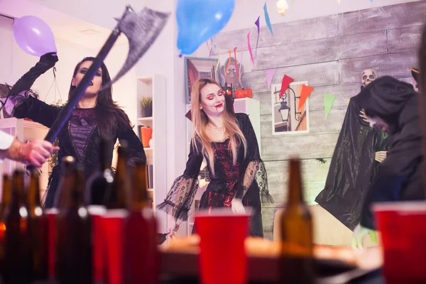 Cheerful vampire woman at a halloween party — Stock Photo, Image