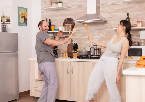 Funny couple dancing in kitchen — Stock Photo, Image