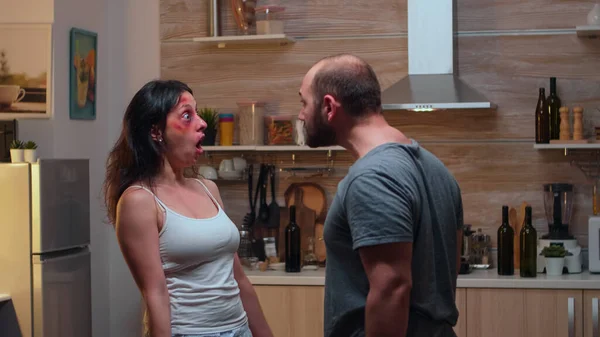 Furious couple fighting in the kitchen